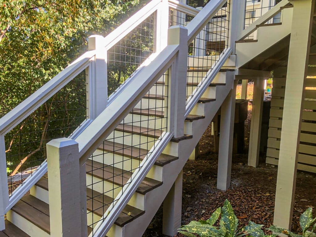Sturdy outdoor staircase with modern railing design, enhancing deck accessibility and aesthetics for homeowners in Middle Tennessee.