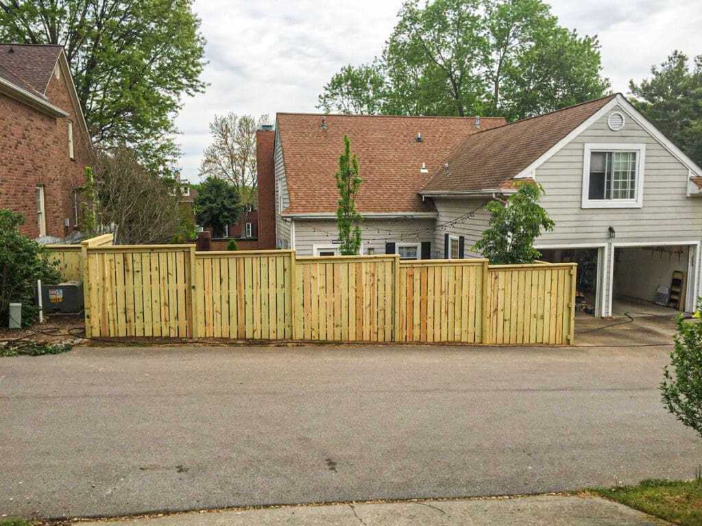 Wood privacy fence installation enhancing outdoor space, providing security and aesthetics for residential property in Dickson County, Tennessee.