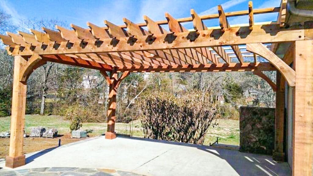 Custom wooden pergola in outdoor setting, showcasing craftsmanship by Home Deck & Fence Co. for homeowners in Middle Tennessee.
