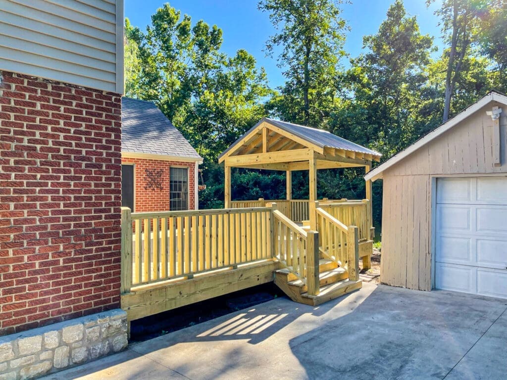 Custom wooden deck with gazebo in backyard, showcasing craftsmanship by Home Deck & Fence Co. in Dickson County, Tennessee.