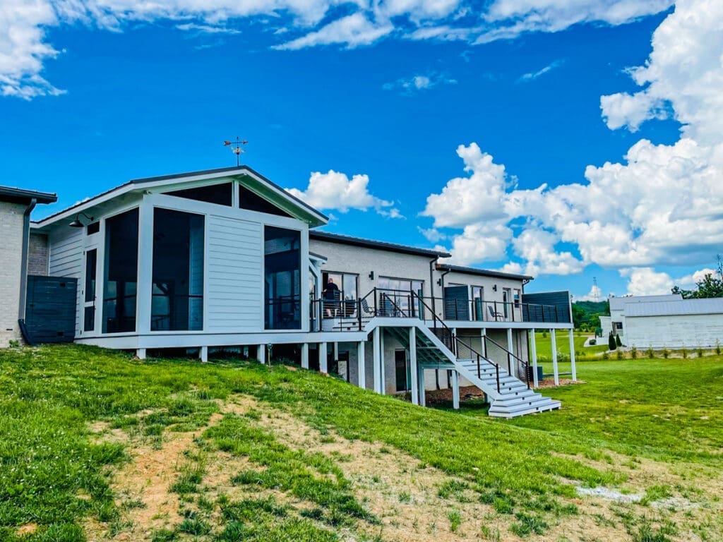 Modern residential deck and screened porch in Middle Tennessee, showcasing quality craftsmanship and outdoor living space.