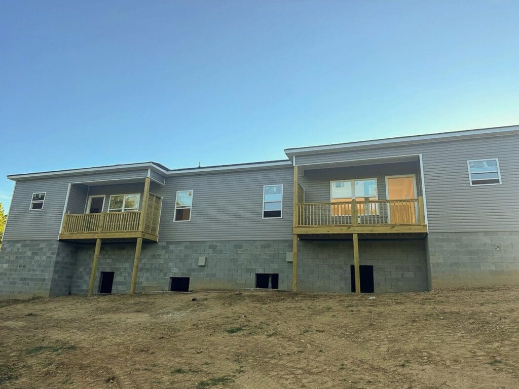 Duplex home in Middle Tennessee featuring modern design, wooden balconies, and low-maintenance finishes, ideal for investment properties.